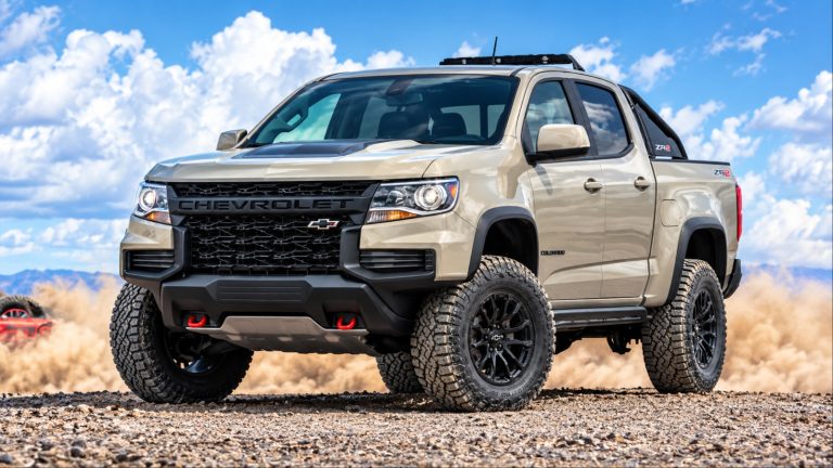 Chevrolet Colorado ZR2 tackling rugged terrain with its off-road tires kicking up dust