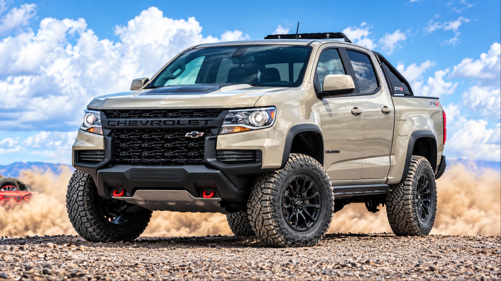 Chevrolet Colorado ZR2 tackling rugged terrain with its off-road tires kicking up dust