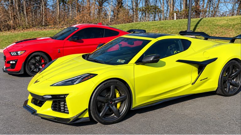 Yellow Chevrolet Corvette C8 parked alongside a red Ford Mustang Shelby GT500