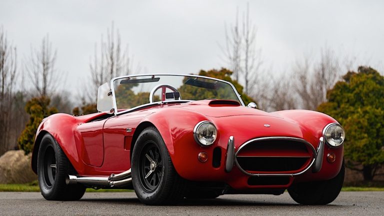 Classic Shelby Cobra roadster showcasing its iconic design and muscular proportions