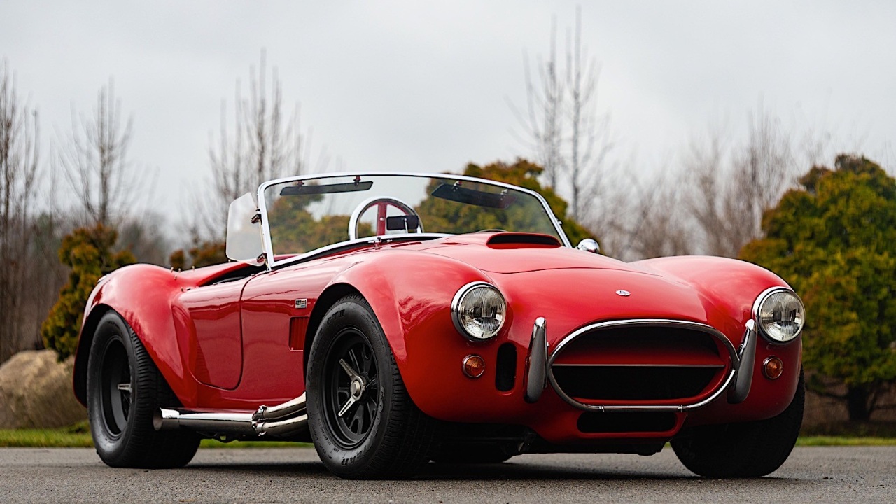 Classic Shelby Cobra roadster showcasing its iconic design and muscular proportions
