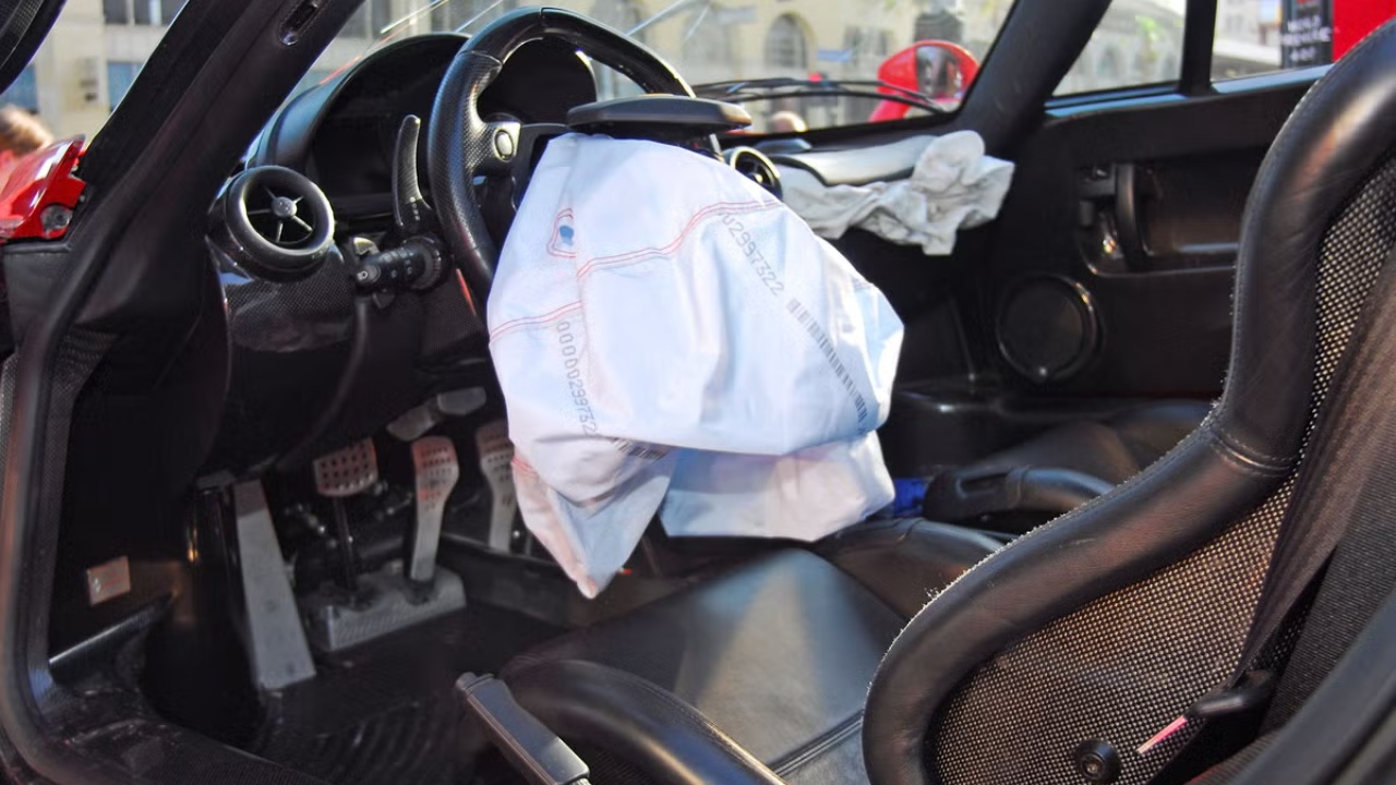 Deployed airbags fill the cabin after a collision, showing the safety system in action