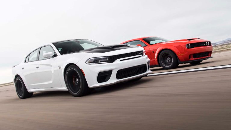 Dodge Charger and Challenger racing side by side on a track