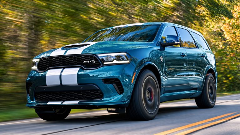 Dodge Durango SRT driving quickly along a tree-lined road