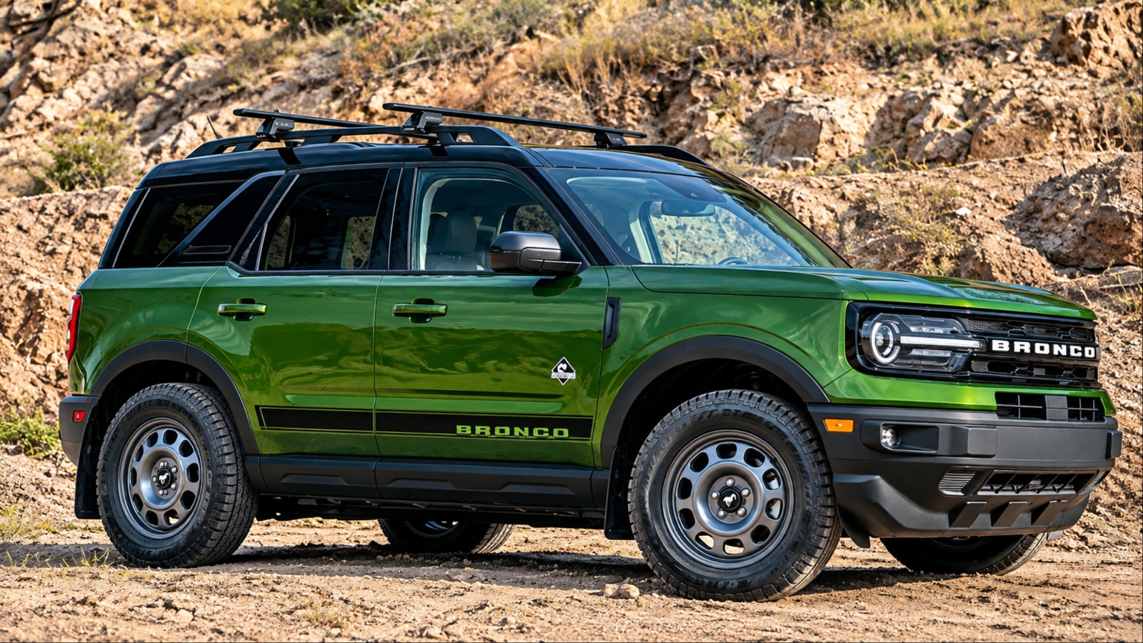 Ford Bronco Sport navigating rugged terrain, emphasizing its adventurous design and off-road capability