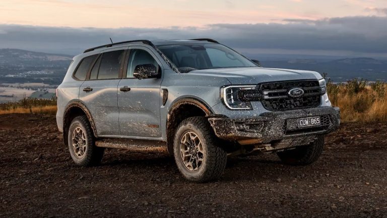 Ford Everest covered in mud after tackling rugged off-road terrain at sunset