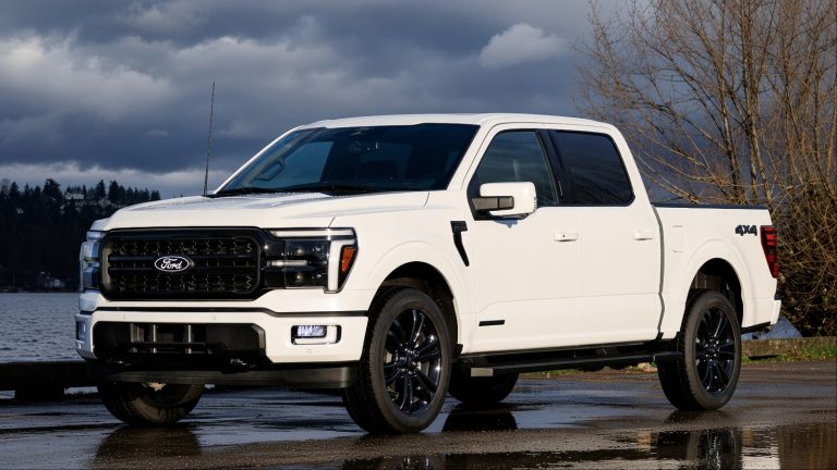 White Ford F-150 pickup parked outdoors under dramatic winter skies