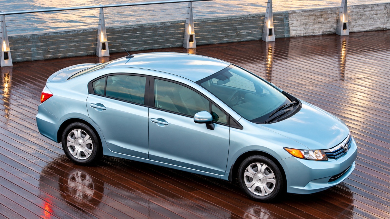A Honda Civic is shown on a rainy day