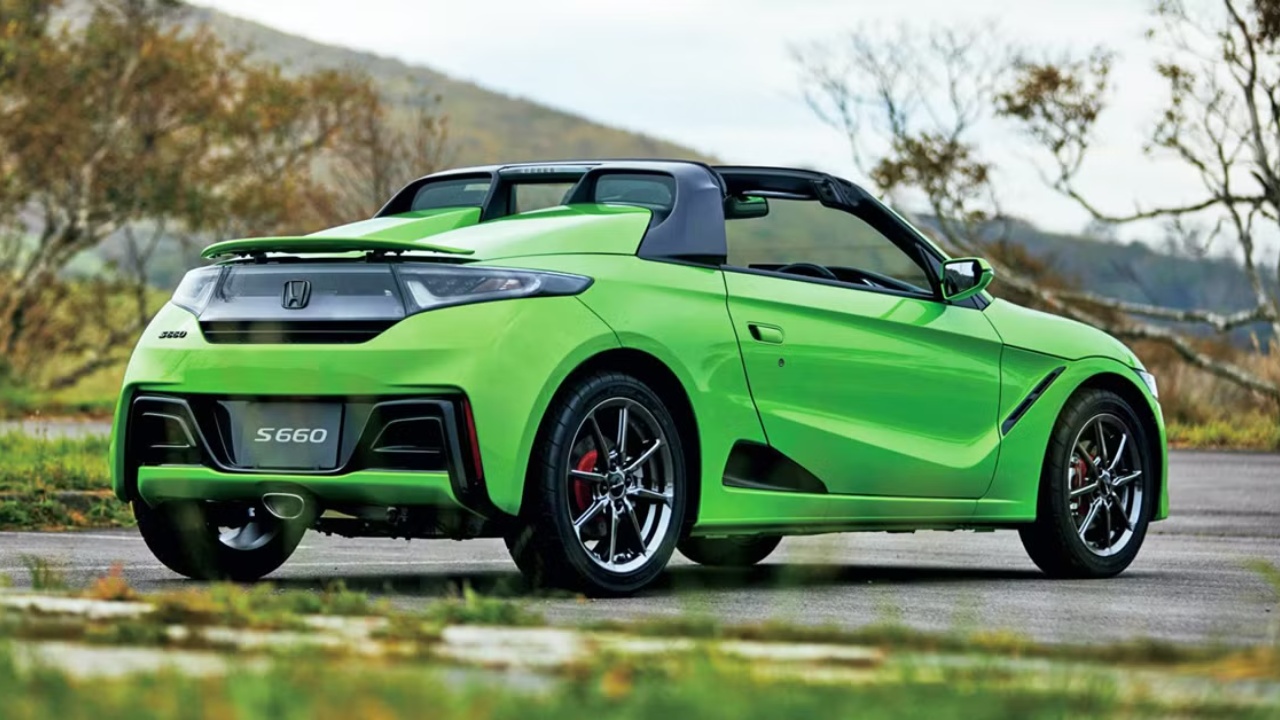 Honda S660 sports car showcasing its compact design, rear wing, and open-top styling