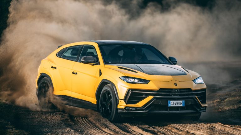 Lamborghini Urus Performante powers through dirt, kicking up dust on a rugged track