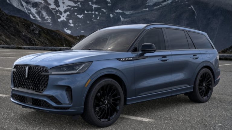 Lincoln Aviator parked on a mountain road surrounded by snow-covered peaks