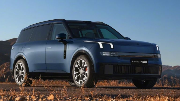 Lynk & Co 900 SUV photographed on a mountain road, showcasing its bold design and large alloy wheels