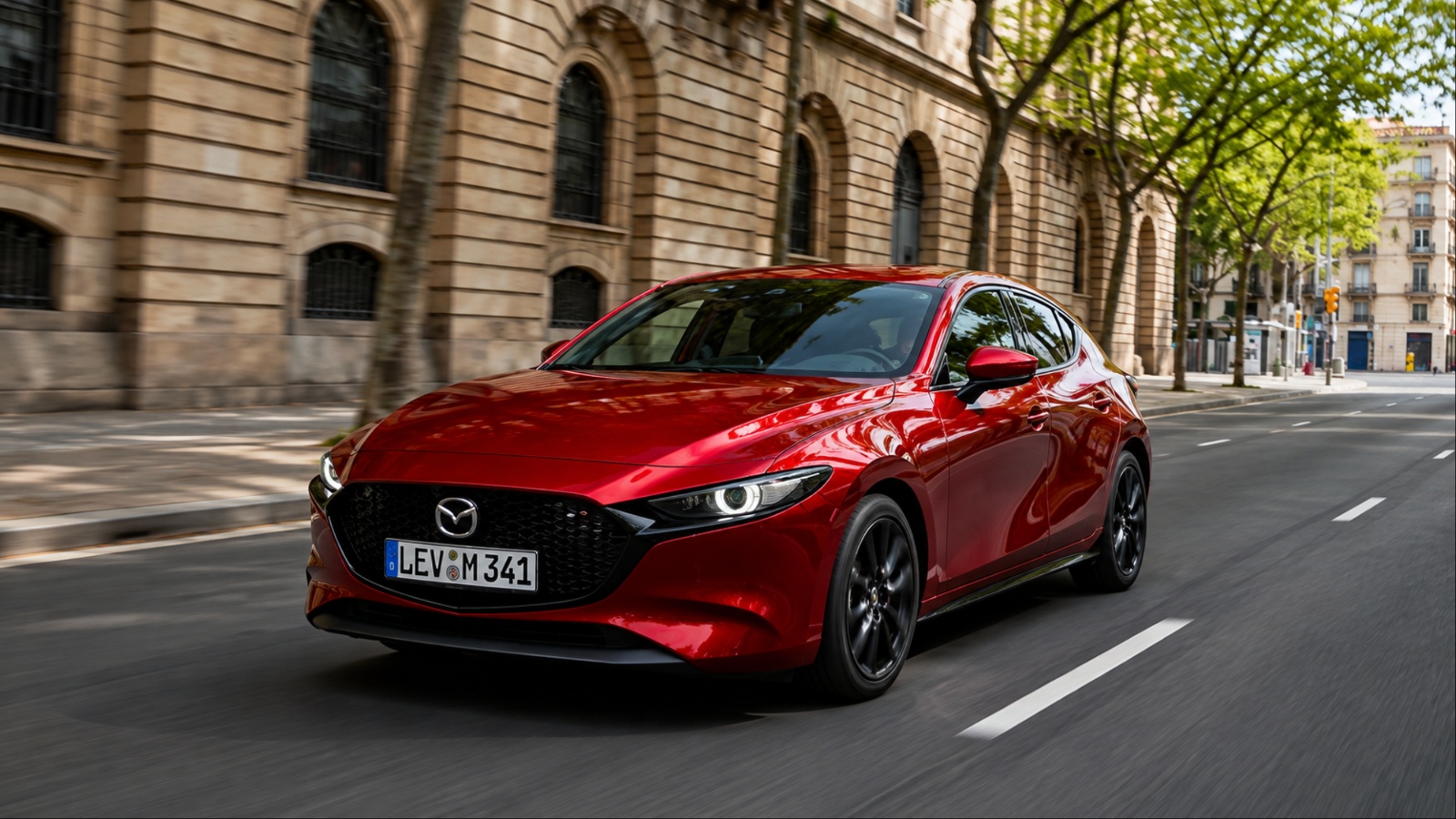 Mazda3 cruising through the city with its sleek, sporty design