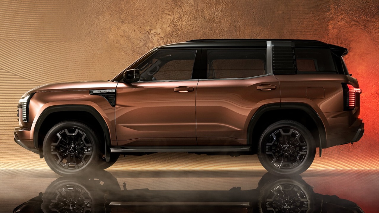 Mitsubishi Pajero SUV shown in side profile against a dramatic backdrop