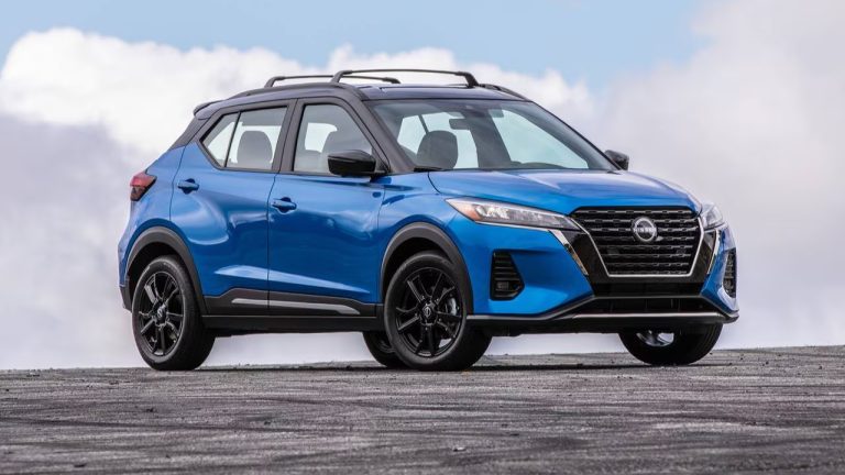 Nissan Kicks parked on an open roadway beneath a bright, cloudy sky