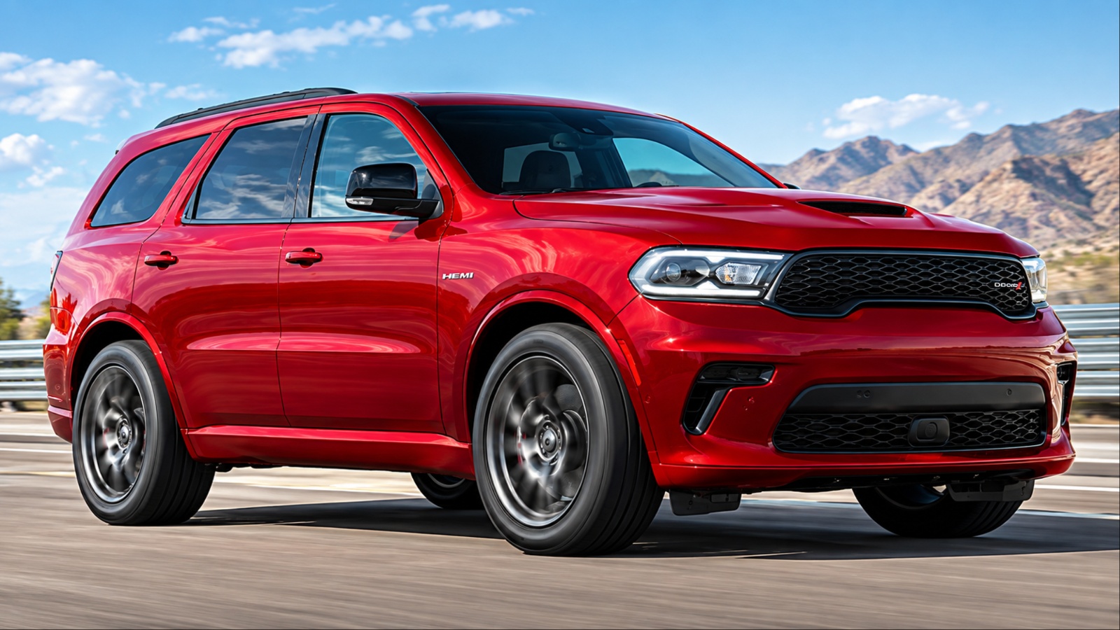 Red Dodge Durango SRT Hellcat driving on a highway, photographed from a front three-quarter angle