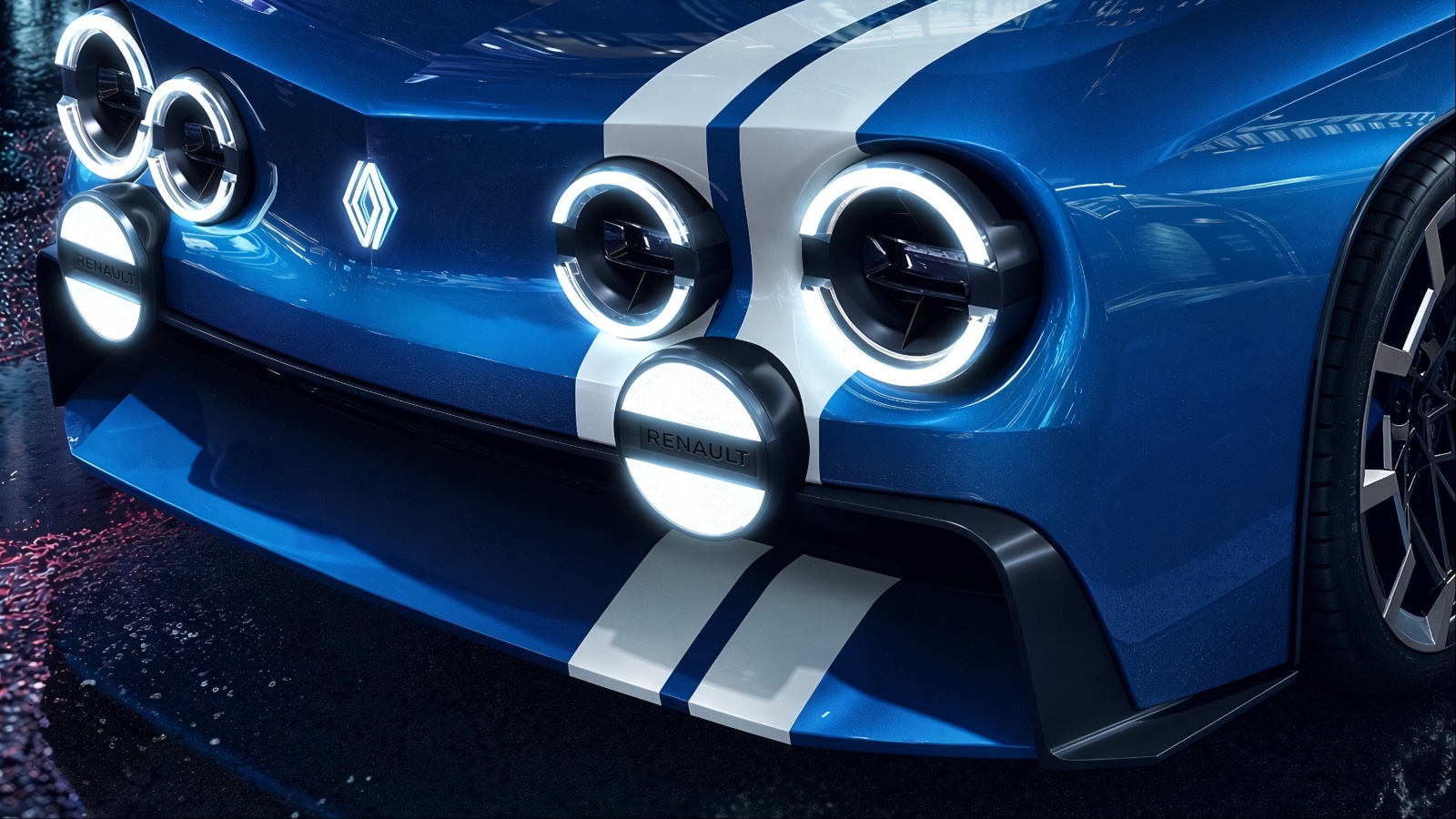 Close-up of blue Renault 8 Gordini with illuminated circular headlights