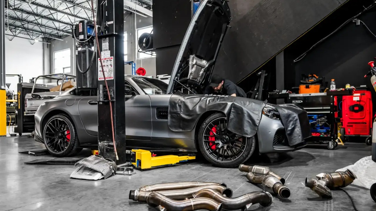 Sports car undergoing performance upgrades in a professional automotive workshop