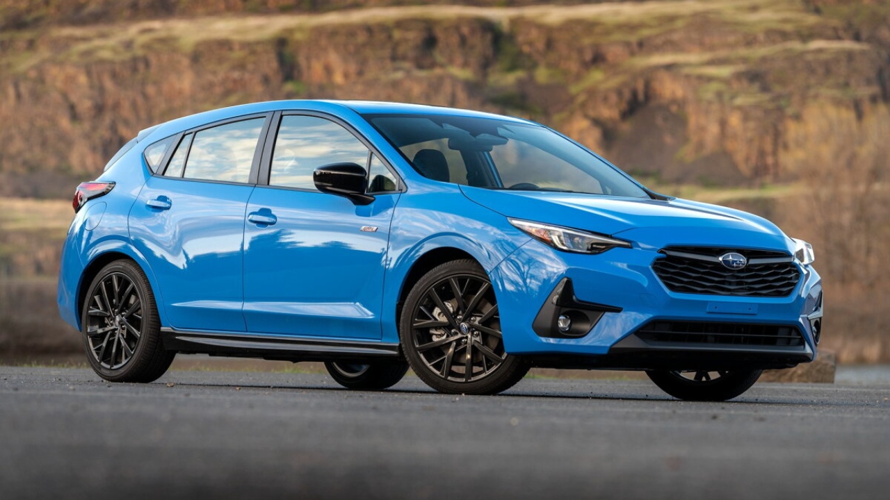 Subaru Impreza showcases its sporty design in a striking blue finish outdoors