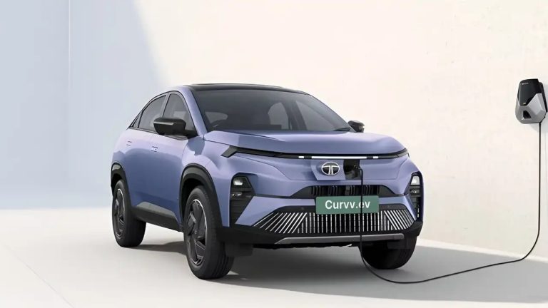 Tata Curvv EV parked indoors while connected to a wall charging station