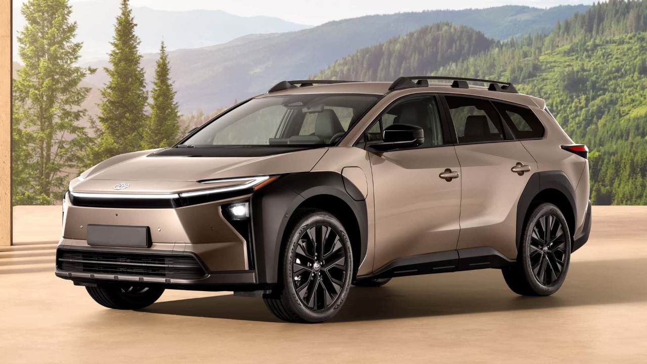 Toyota bZ SUV parked indoors against a scenic mountain backdrop