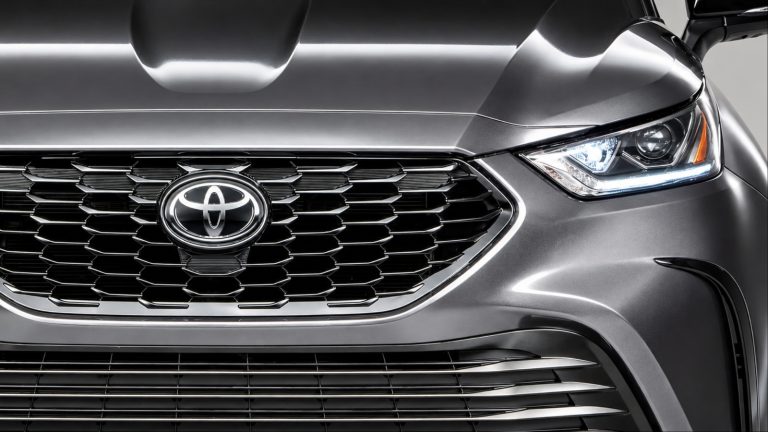Close up of gray Toyota Highlander front grille and headlight