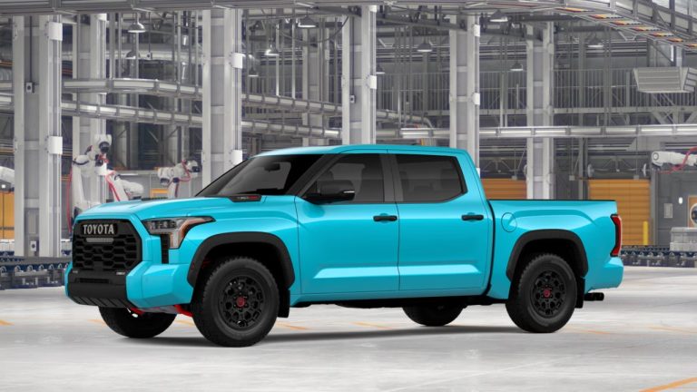 Toyota Tundra pickup truck displayed inside a modern automotive manufacturing facility