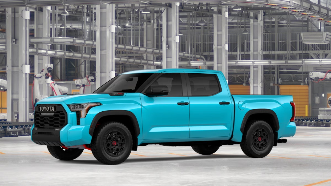 Toyota Tundra pickup truck displayed inside a modern automotive manufacturing facility