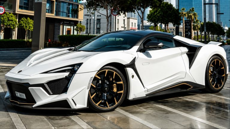 White W Motors Fenyr Supersport hypercar parked on city street