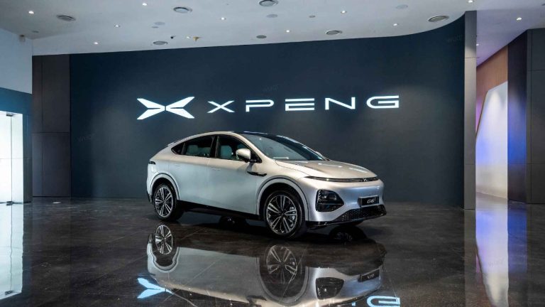 XPeng vehicle displayed inside a modern showroom with prominent brand signage
