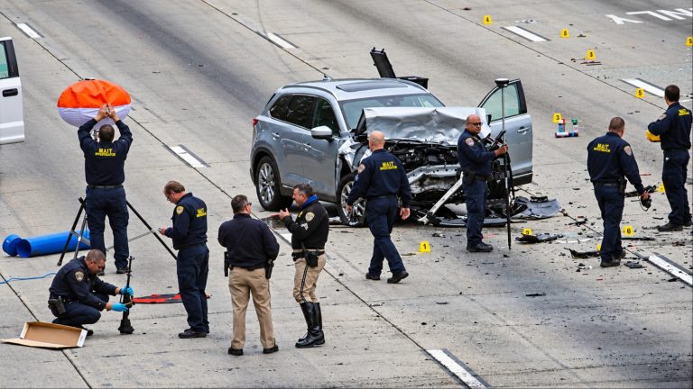 Crash investigation at highway accident scene