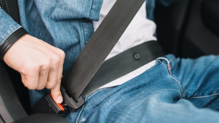 Fastening Car Seat Belt Close-Up