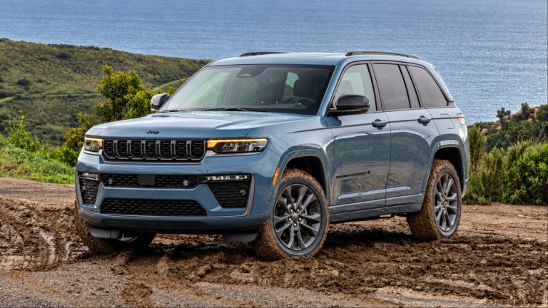 A Jeep is cruising in the wet mud