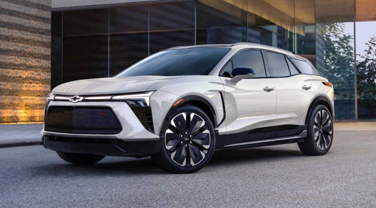 2027 Chevrolet Blazer EV RS parked outside a modern building, showcasing its sleek electric SUV styling