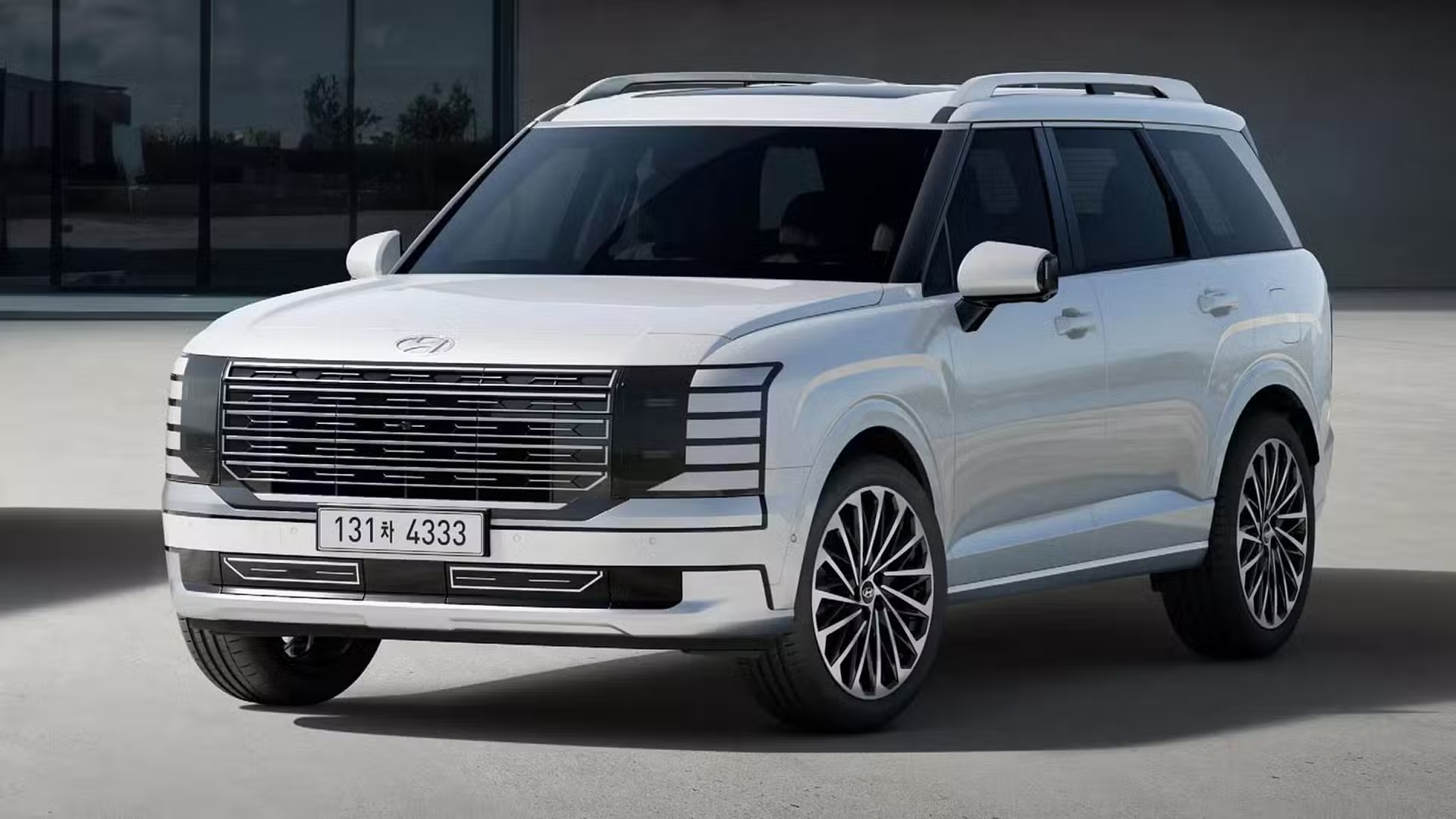 2027 Hyundai Palisade Hybrid displayed from the front, showcasing its bold grille and distinctive LED lighting