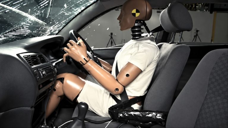 A dummy is stinning in a car crash inspection