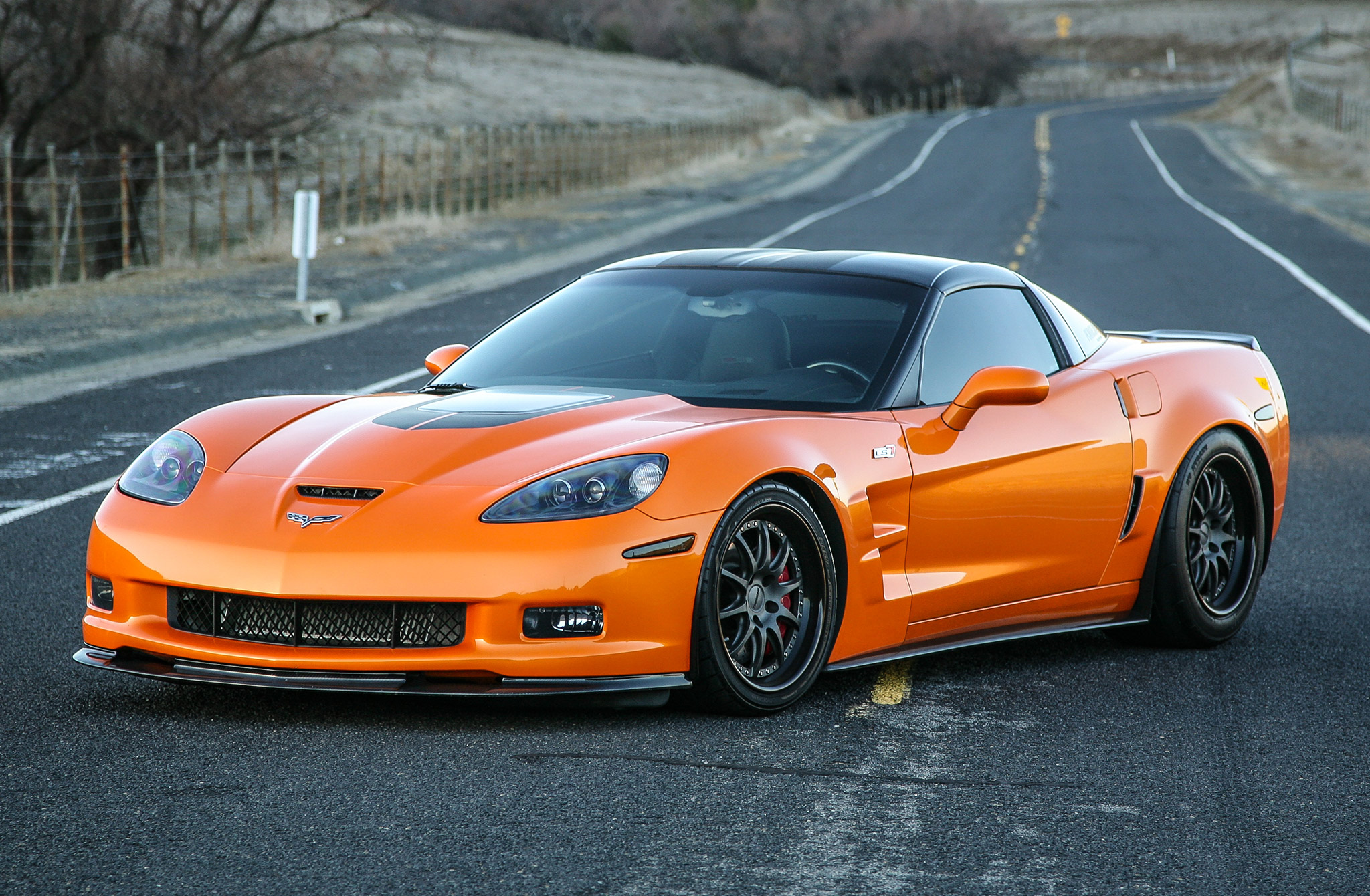 Chevrolet Corvette C6 Z06 parked on an open road, showcasing its aggressive styling and performance design