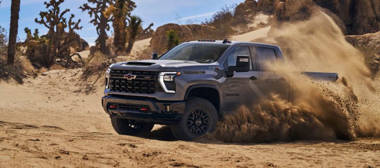 A Chevy Silverado is drifting on a muddy road