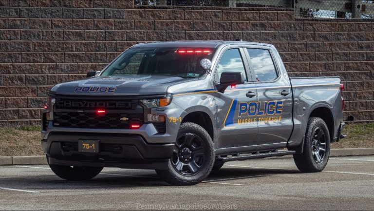 A Chevy is standing in a small paking