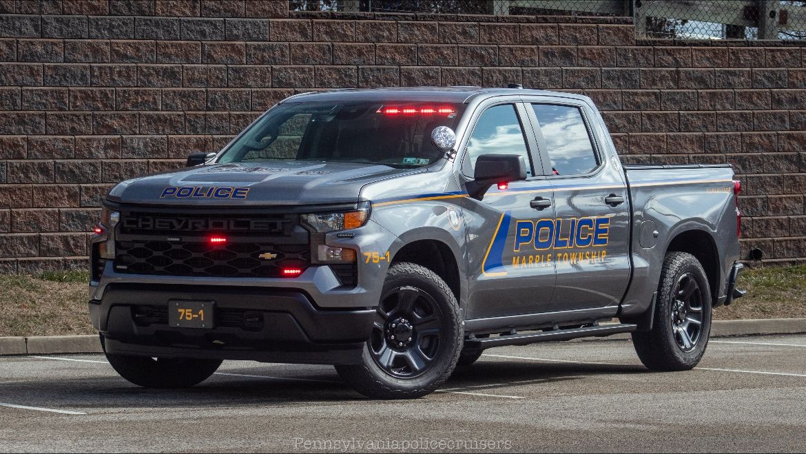 A Chevy is standing in a small paking