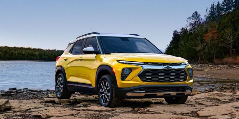 Chevrolet Trailblazer ACTIV parked on rocky lakeside terrain, showcasing rugged styling and outdoor versatility