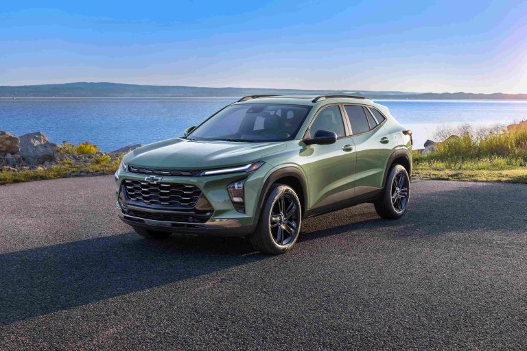 Chevrolet Trax parked beside a scenic lakeside, highlighting its modern styling and compact SUV design