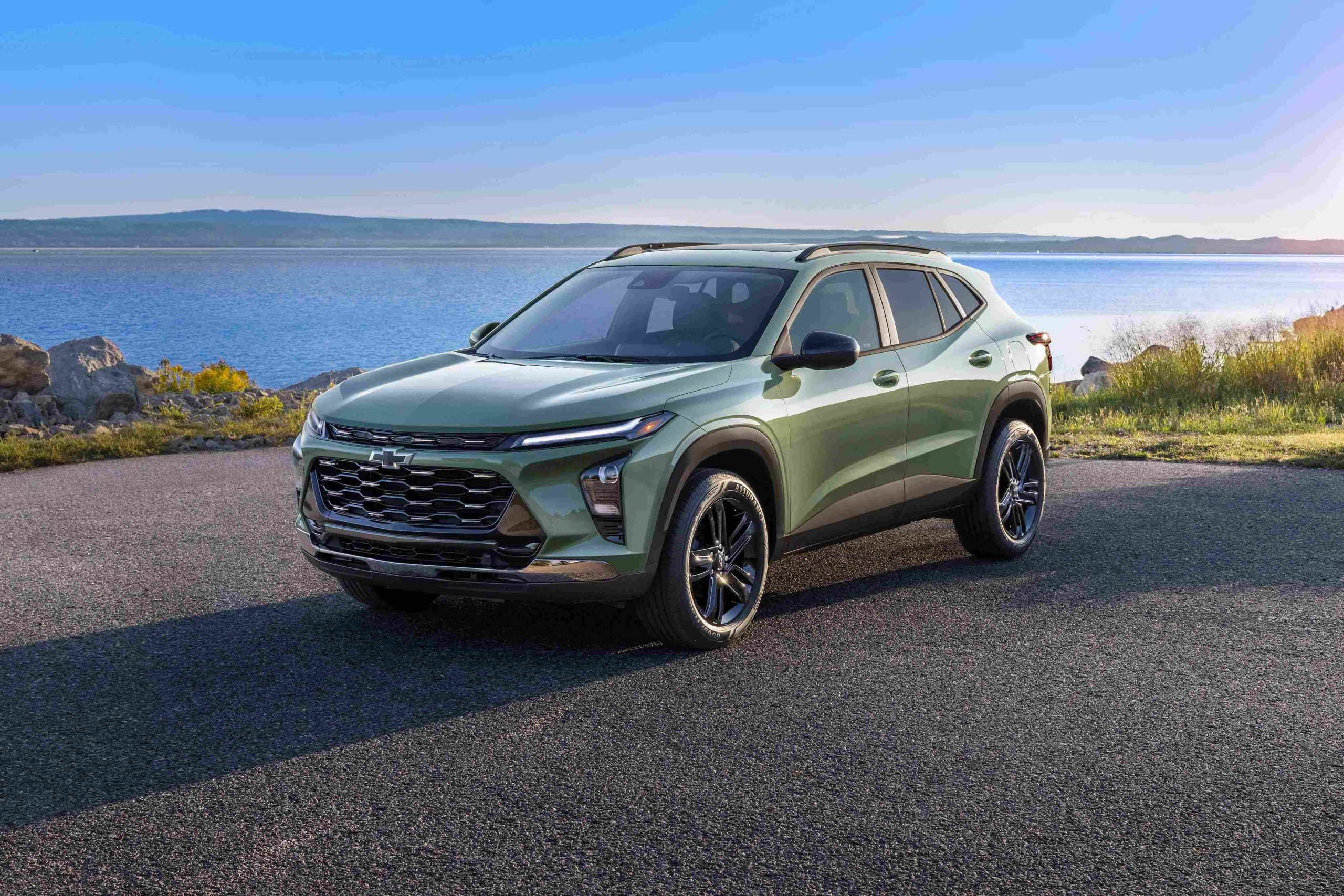 Chevrolet Trax parked beside a scenic lakeside, highlighting its modern styling and compact SUV design