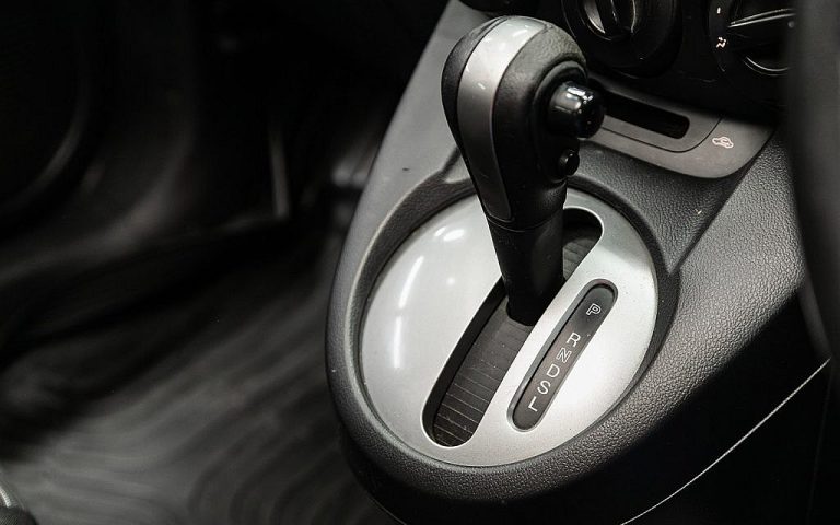 Close-up of an automatic transmission gear selector showing Park, Reverse, Neutral, Drive, and Low settings