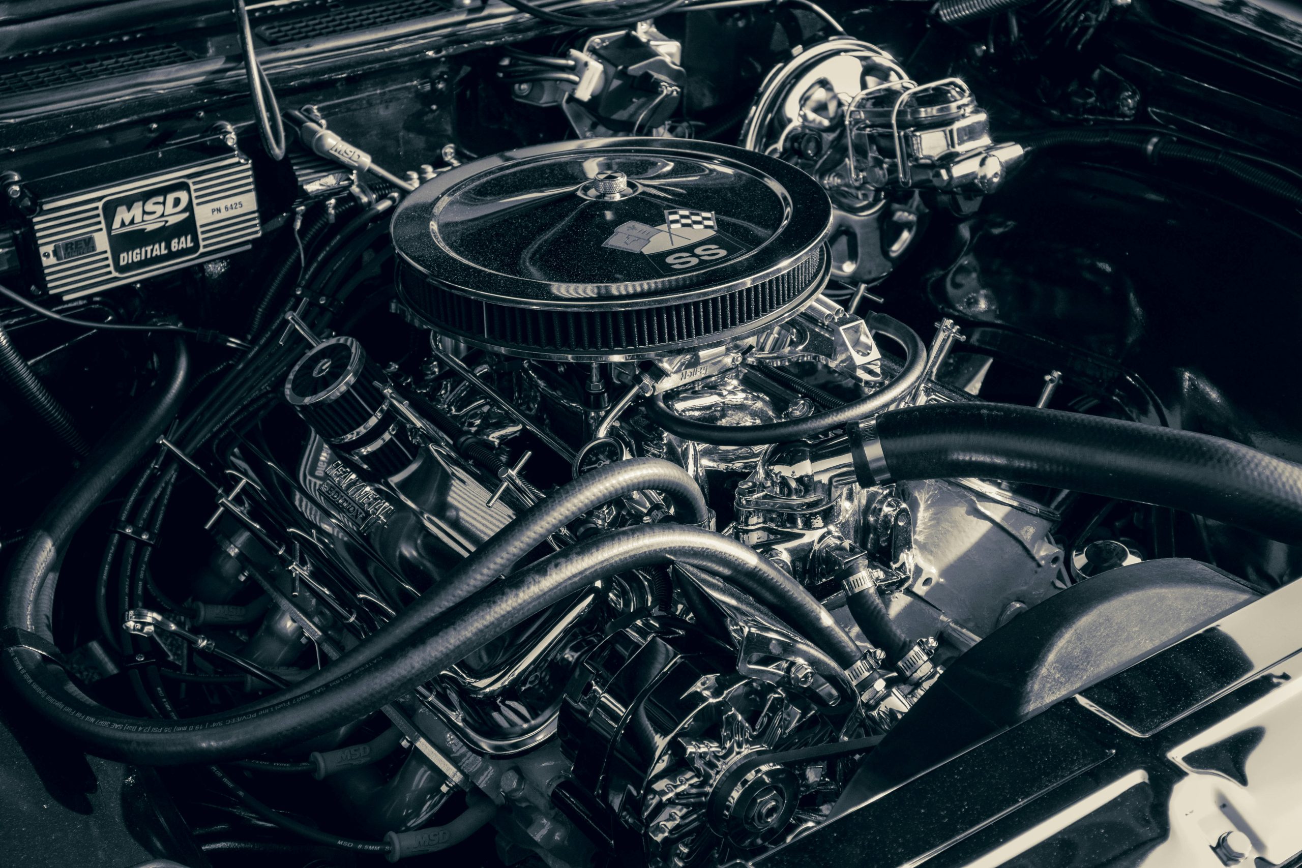 An engine isnide a hood is shown