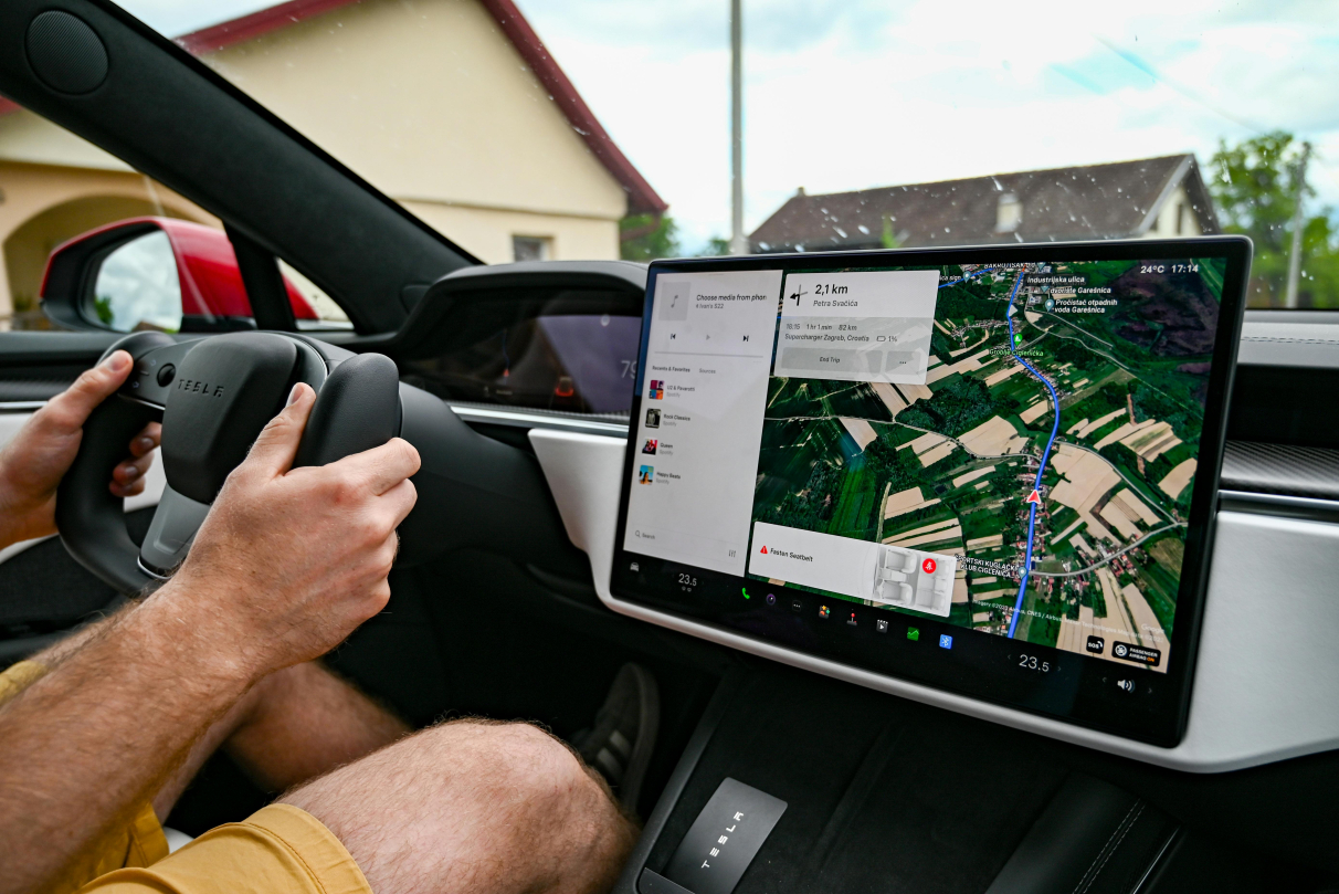 A man is driving the car with the help of navigational display