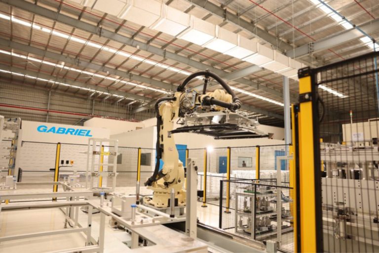 Industrial robotic arm operating inside Gabriel’s automated automotive manufacturing facility