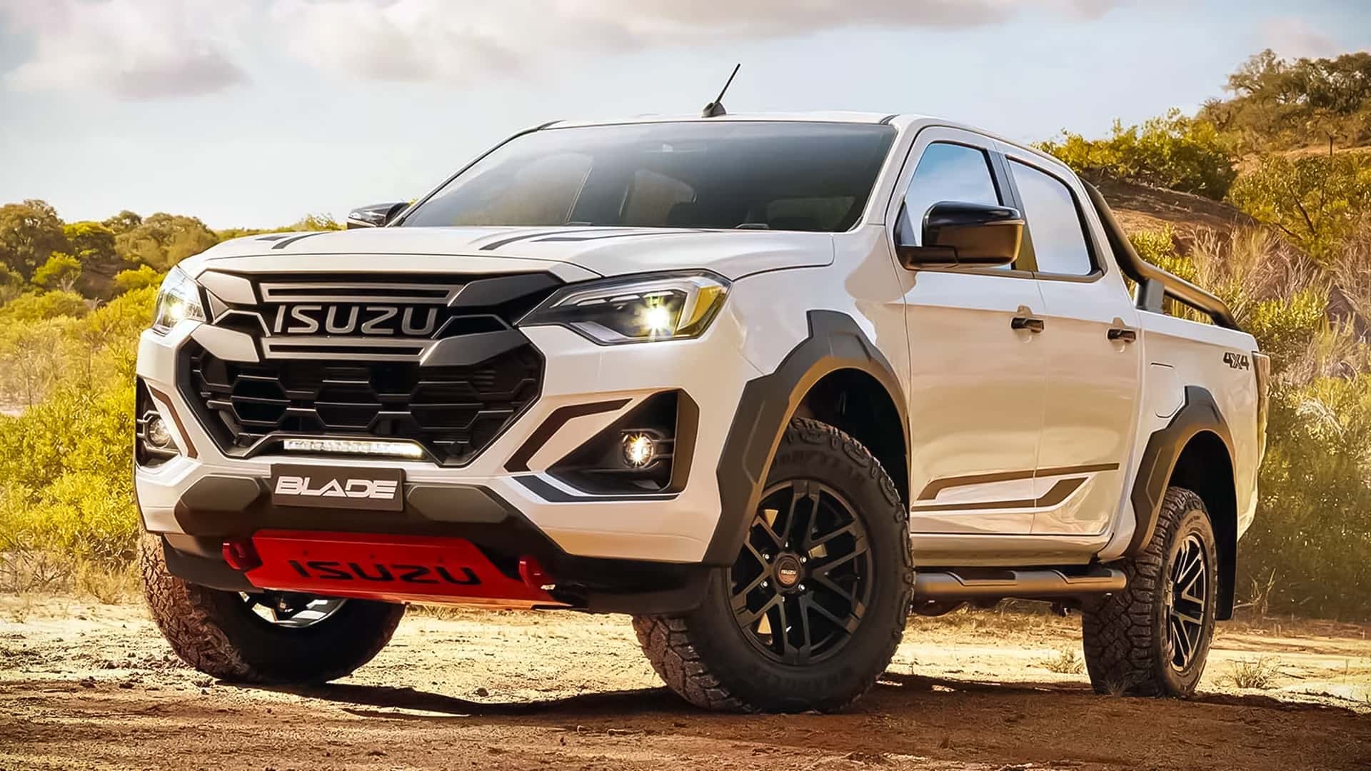 Isuzu D-Max Blade pickup parked on rugged terrain, showcasing off-road styling and capability