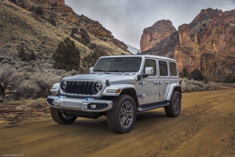 Jeep Wrangler 4xe drives along a rugged canyon trail, showcasing its off-road capability