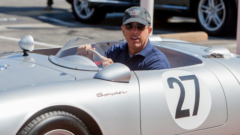 Jerry Seinfeld drives a vintage Porsche Spyder bearing racing number 27 during a historic event